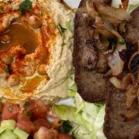 Plate Gyro · Yalla yalla salad, hummus, seasoned beef and grilled onions over cabbage, pita bread, side t...