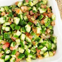 Chopped Salad · Fine chopped tomato, cucumber and parsley, with fresh lemon and olive oil.