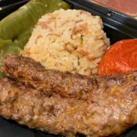 Kafta Kebab · A tasty broiled blend of ground beef, onion and spices served with rice and grilled vegetable.