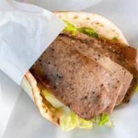 Gyro · Tzatziki sauce, gyro meat, lettuce, tomatoes and onions.