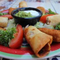 Fiesta Plato · A mix of appetizers, featuring your choice of shredded beef or chicken taquitos, jalapeño po...