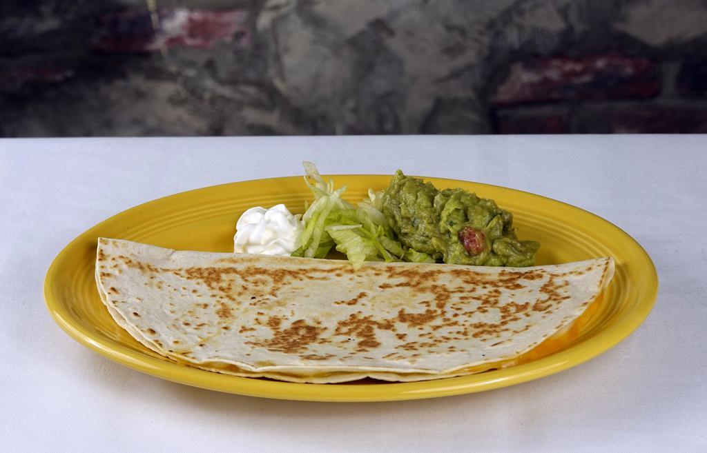 Cheese Quesadilla · A flour tortilla filled with melted cheese, served with a side of guacamole and sour cream. Vegetarian-friendly.