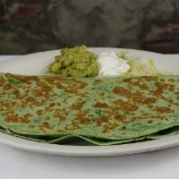Vegetable Quesadilla · A spinach flour tortilla filled with sauteed mushrooms, onions, bell peppers, and melted che...