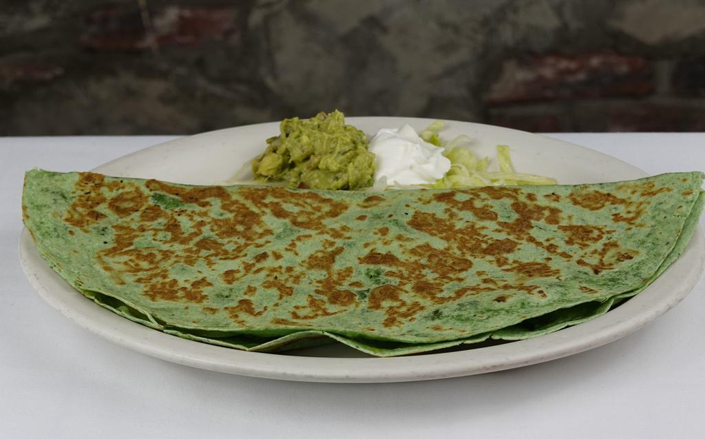 Vegetable Quesadilla · A spinach flour tortilla filled with sauteed mushrooms, onions, bell peppers, and melted cheese, served with a side of guacamole and sour cream. Vegetarian-friendly.