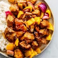 Sweet And Sour Pork · Tender pork golden-fried with pineapple, green peppers, onions and carrots in sweet &sour sa...