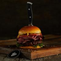 Pastrami Burger · Black Angus ground beef burger on a brioche bun topped with pastrami, white onions, pickles,...