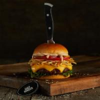 Frita Burger · Black Angus ground beef burger on a sesame bun topped with cheddar, lettuce, tomatoes, white...