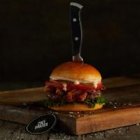 Chef'S Bacon Burger · Black Angus ground beef burger on a brioche bun topped with bacon, lettuce, tomatoes, white ...