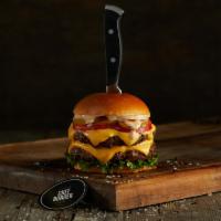 New-York Style Double · Black Angus ground beef burgers (2) on a brioche bun topped with cheddar, bacon, lettuce, to...