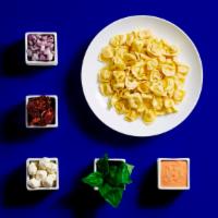 Cheese Tortellini · Build your own pasta with your choice of sauce, toppings, and garnishes!