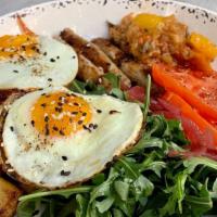 Breakfast Plate · Two fried eggs (cage-free), turkey sausage,  rosemary potato,  heirloom tomato, arugula, pic...