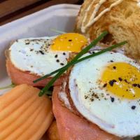 Smoked Salmon Croissant · Smoked Salmon, Two Cage Free Sunny Side Up Eggs, Heirloom Tomato, Dill Goat Cream Cheese, Wi...