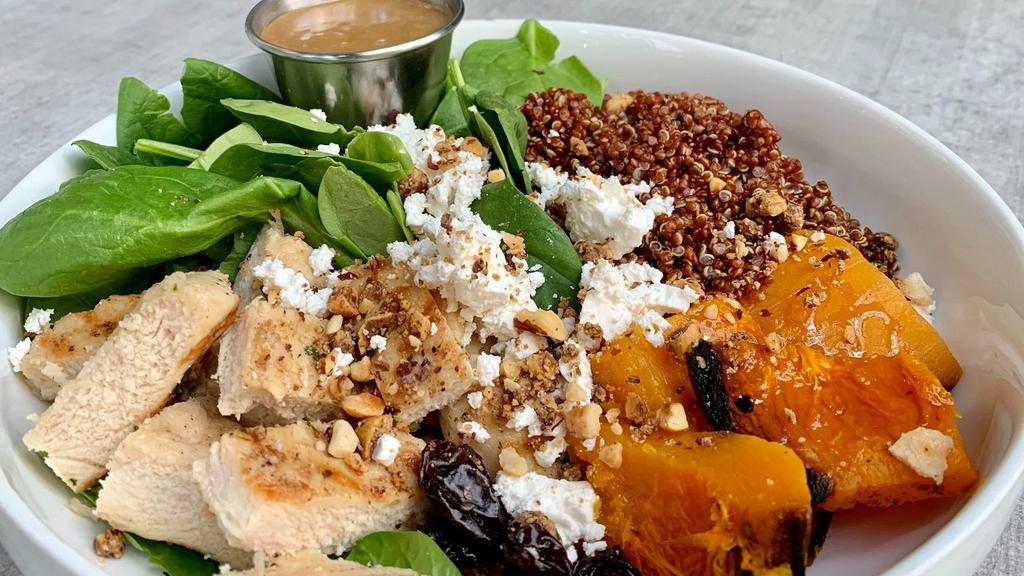 Chicken Squash Salad · Fresh spinach, roasted butternut squash, all-natural grilled chicken breast, red quinoa, feta cheese, dried black cherries, roasted hazelnut and balsamic vinaigrette dressing