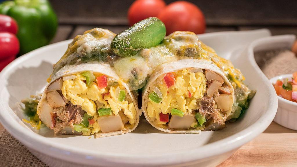 Chile Verde Burrito · Perkos Cafe favorite: Seasoned and slow roasted pork in chile verde sauce wrapped in a tortilla with scrambled eggs, country potatoes, onions, bell peppers and jack and Cheddar cheese. Then topped with more chile verde and melted cheese.