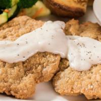 Chicken Fried Steak & Eggs · Perkos Cafe favorite: A half-pound of homestyle breaded chicken fried steak topped with coun...