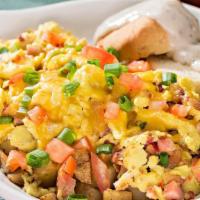 Farmers Skillet · Smoked ham, crisp bacon, tomatoes, green onions and country potatoes all tossed with scrambl...