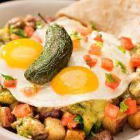 Chile Verde Skillet · Perkos Cafe favorite: Slow roasted pork in chile verde sauce over country potatoes topped wi...