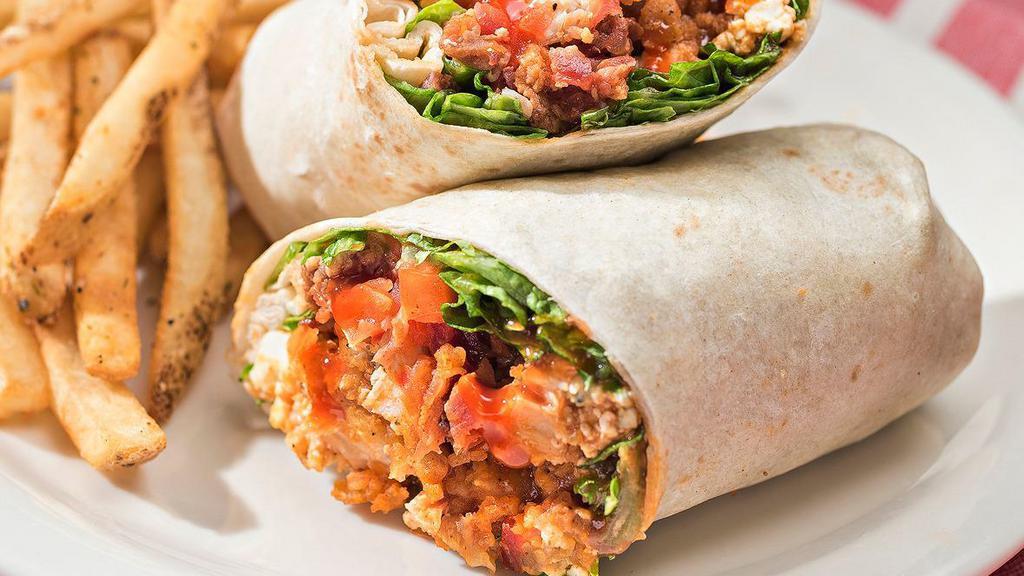 Buffalo Bleu Wrap · Crispy chicken tossed in our buffalo sauce, wrapped in a flour tortilla with lettuce, tomato, bacon and Bleu cheese.