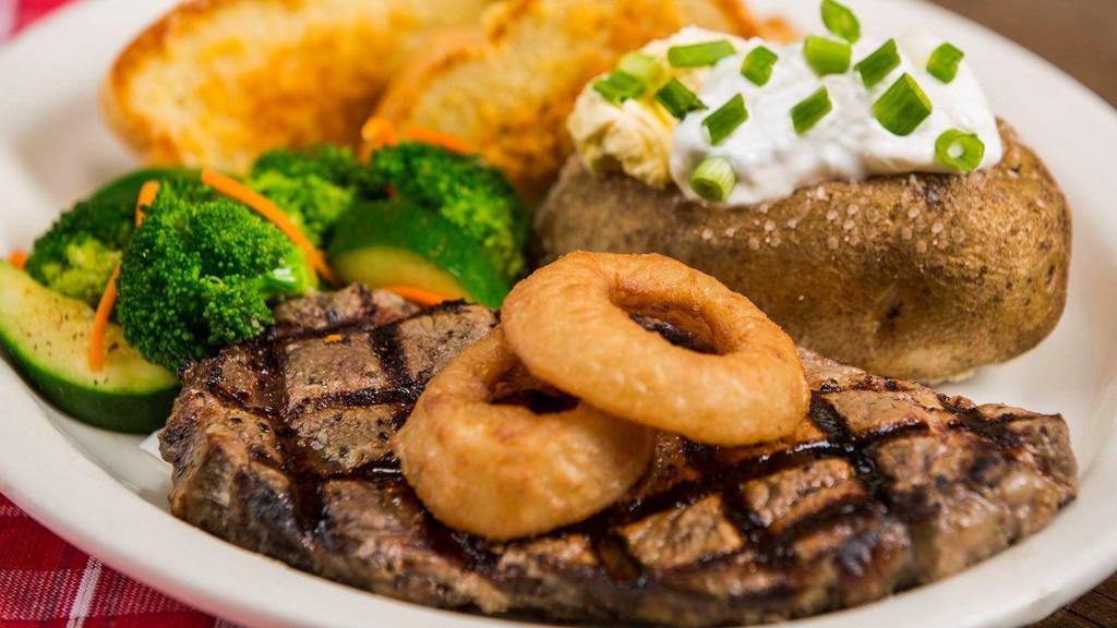 River City Ribeye · Perkos Cafe favorite: A tender, 10 oz ribeye topped with breaded onion rings.