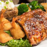 Baby Back Ribs & Shrimp · Baby back ribs rubbed with brown sugar and slow roasted until tender, paired with four fanta...