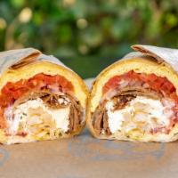 *Greek Breakfast Burrito · Prepared with 3 scrambled eggs, Choice of protien, Feta cheese, Roma tomatoes, Red onions, H...