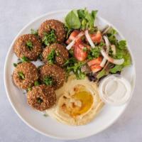 Falafel Pita Wrap · Fried nuggets of chickpeas and fava beans, mixed with exotic spices, fresh garlic, and onion...