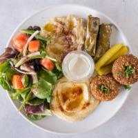 Vegiterranean Combo · Falafel, hummus, baba ganoush, grape leaves, salad, and pickles.