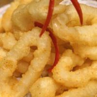 Calamari Wonder · Battered calamari rings, fried to golden perfection, and served with Thai sweet chili sauce.