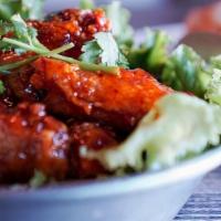 Spicy Chicken Wings · Golden crispy chicken wings, stir fried with a sweet and hot sauce.