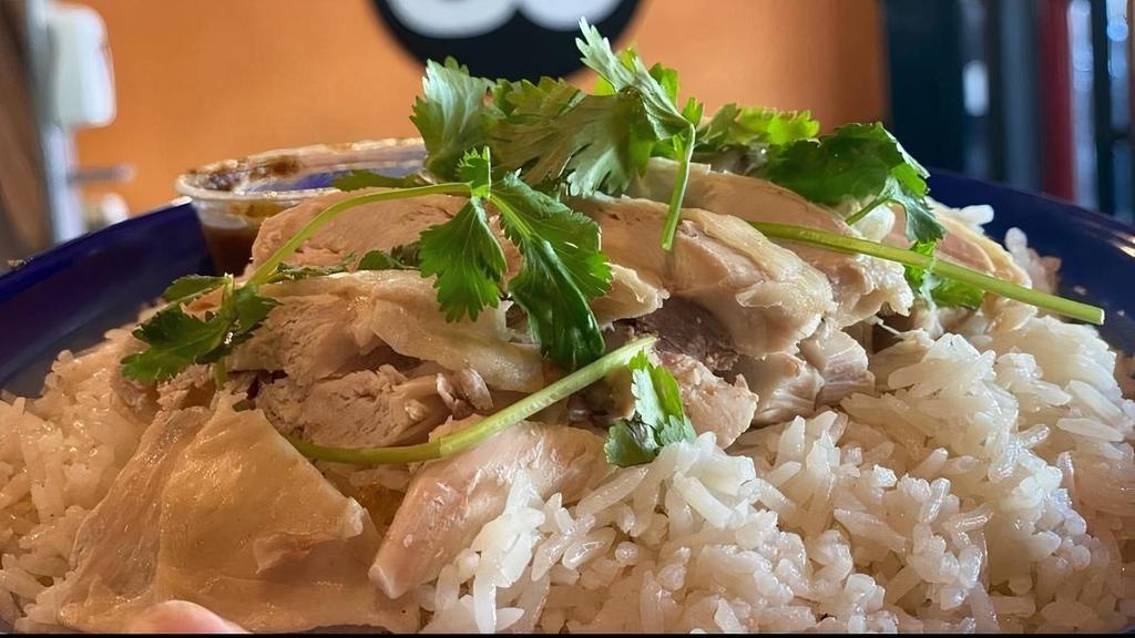 Khao Mun Gai · Steamed chicken with ginger Jasmine rice, served with our house ginger sauce.