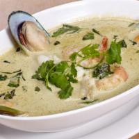 Seafood Green Curry · New England green lip mussels, tiger prawns, tender squid, jumbo scallops swimming in a rich...