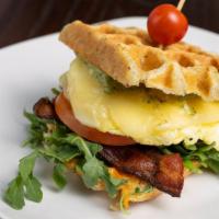 Eggcellent · Cherrywood smoked bacon, cage free egg, Fontina, arugula, tomato, basil pesto, sun-dried tom...