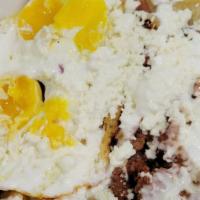 Chulada Chilaquiles · Homemade chips smothered in red or green salsa topped with sour cream, queso fresco, served ...