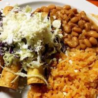 Tacos De Papa · Three rolled potato tacos deep fried and topped with cabbage, queso fresco, sour cream, guac...