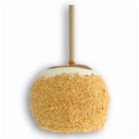 Cheesecake Apple · Caramel-covered granny smith apple dipped in white confection, rolled in crushed graham crac...