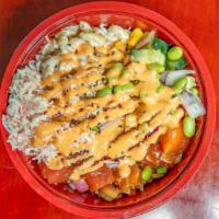 The Hawaiian Poke Bowl · Rice, 3 scoops of Hawaiian Poke, Crab Salad, Mac Salad, Corn, Onion, Cucumber, Green Onion, ...