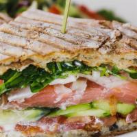 Smoked Salmon Sandwich · Tomato, fennel, cucumber, watercress, caper fennel aioli, olive bread.