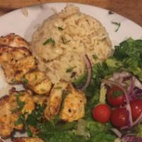 Chicken Kabobs · Two skewers of grilled marinated chicken kabob. All entrees are served with Gaby's house sal...