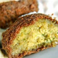 Falafel   · 4pcs. Deep-fried vegetarian patties made from chickpeas, fava beans, vegetables and spices.