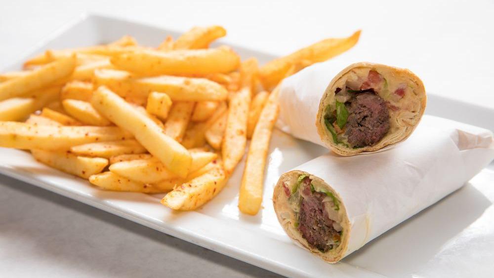 Beef Shish Kabob Pita · Beef kabob with hummus, tomatoes, onions and parsley. Each served with it's own distinctive dressing. Served with your choice of rice, French fries or side house salad.