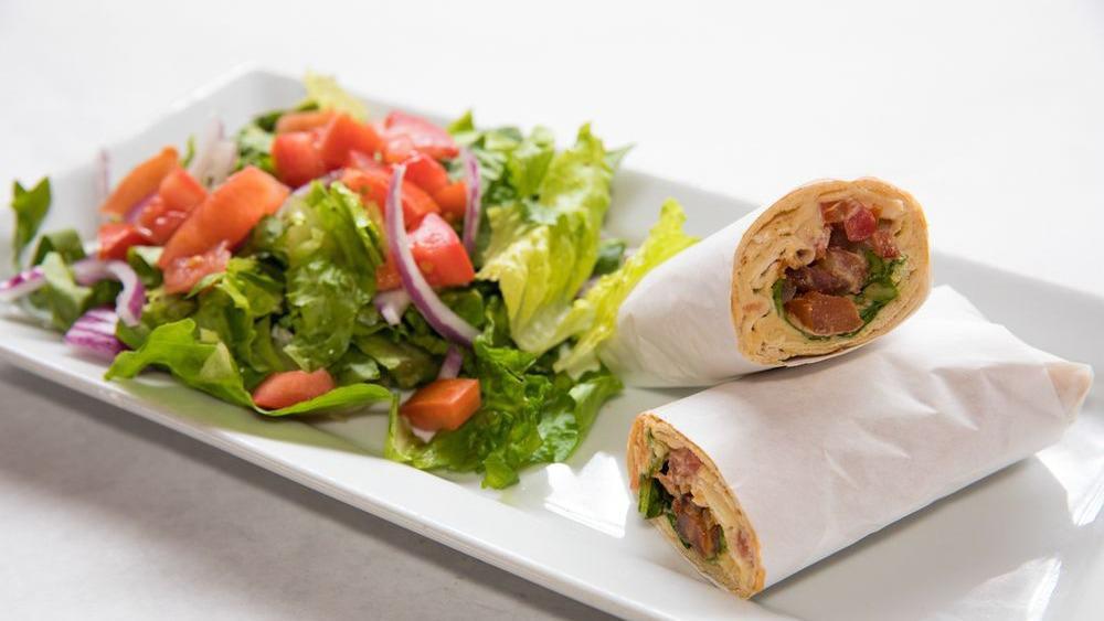 Maanik Pita · Beef sausage with hummus, tomatoes, onions and parsley. (Contains pine nuts). Each served with it's own distinctive dressing. Served with your choice of rice, French fries or side house salad.