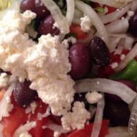 Greek Salad · Vegetarian. Romaine lettuce, tomato, onion, feta cheese and kalamata olives (with pit inside...