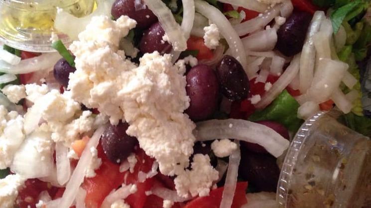Greek-Lamb Salad · Grilled  lamb served with Romaine lettuce, onion, tomatoes, Greek dressing topped with feta cheese kalamata olives.