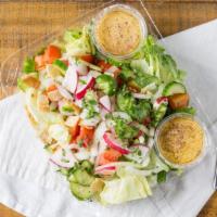 Fattoush Salad · Vegetarian. Romaine lettuce, tomatoes, onions, radishes, cucumber and parsley tossed in our ...