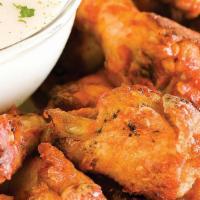 Buffalo Wings · Chicken wings marinated in spicy sauce and served with ranch or bleu cheese dressing.