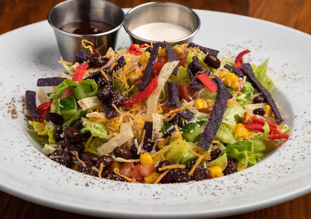 Bbq Chicken  Salad · Lettuce, corn, black beans, tomatoes and tortilla strips with Monetary Jack cheese tossed in our homemade herb ranch and drizzled with BBQ sauce.