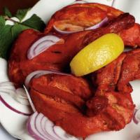 Tandoori Chicken · (Bone-in) chicken pieces marinated and cooked in clay oven.