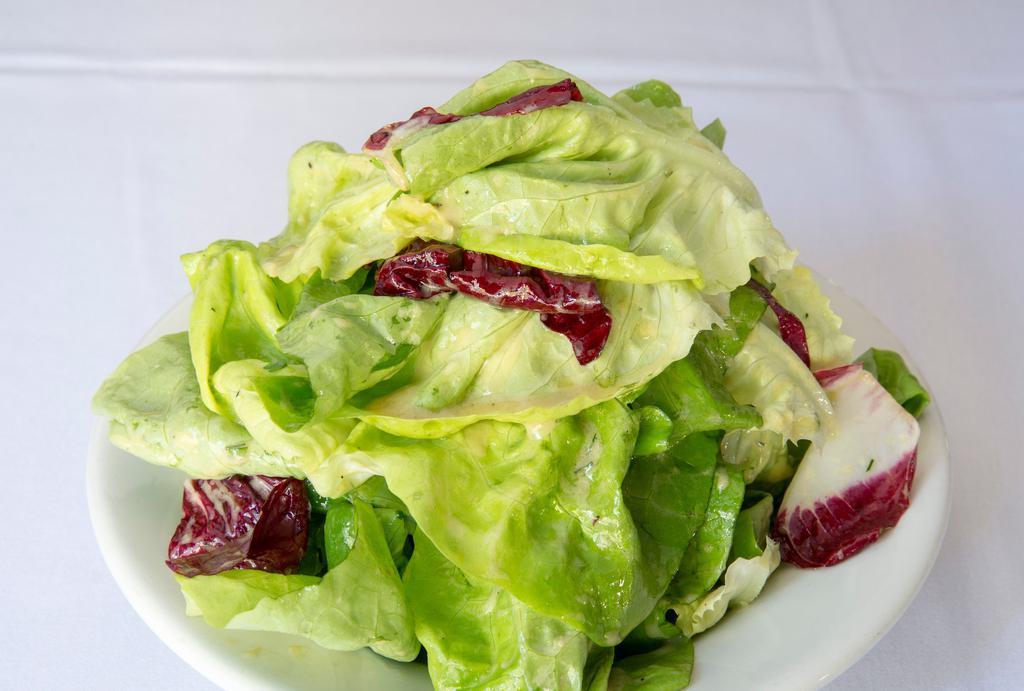 Green Salad · With butter lettuce hearts, treviso, fresh herbs, and Dijon vinaigrette.