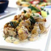 Coconut Cauliflower Bezule (G, V) · Crisp cauliflower florets in coconut sauce and fried curry leaves. A House Specialty!