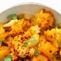 Aloo Gobhi (G), (V) · Potato wedges (aloo) and cauliflower florets (Gobhi) cooked to perfection with ginger, coria...
